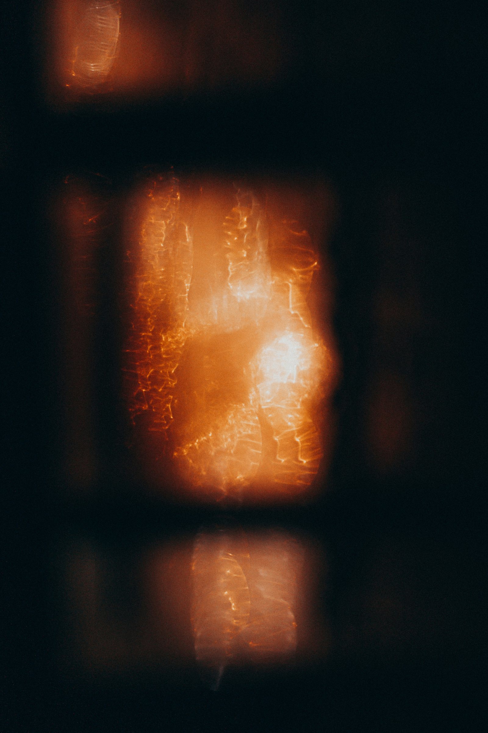 Amber light, partly visible in darkness